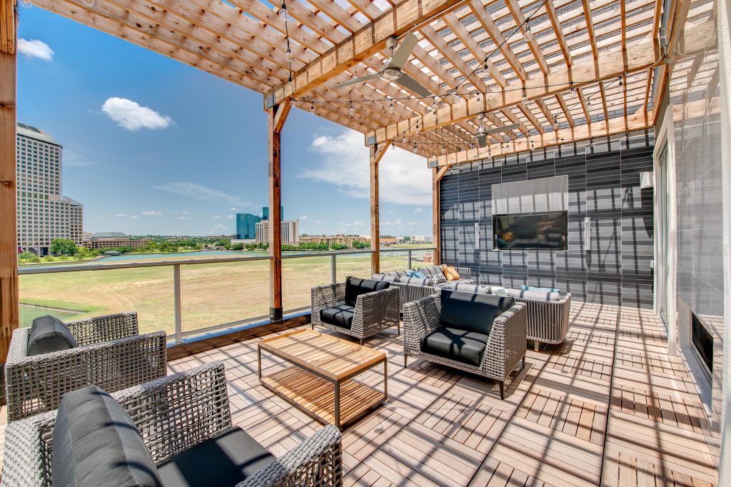 outdoor patio lounge with seating and in-wall tv